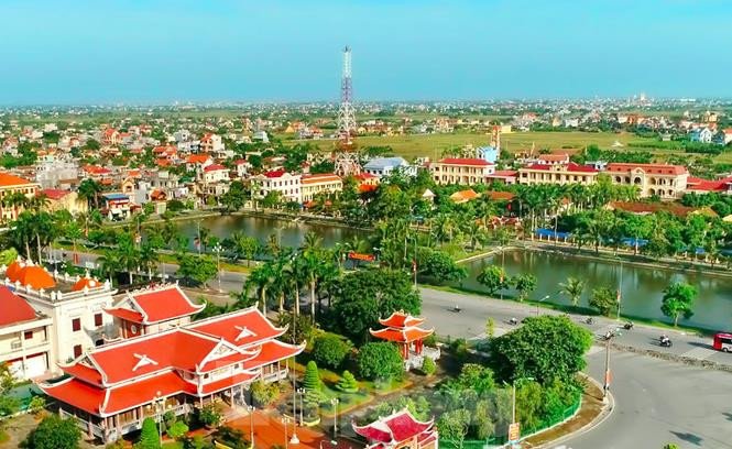 Chuyên viên quản lý đô thị cấp huyện đang làm việc, phối hợp phát triển đô thị